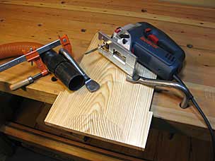 Setting up to saw feet on six board chest