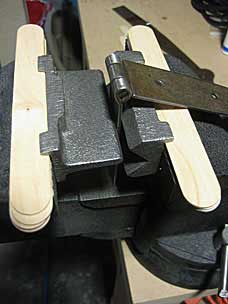 Setting up to bend strap hinge in vise