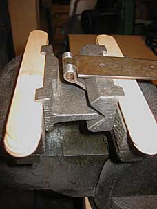 Strap hinge bent in vise