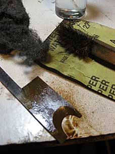 Removing rust from molding plane iron