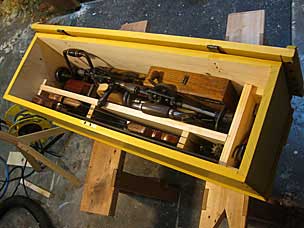 Yellow boarded chest with tools