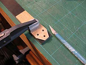 Setting up to taper end of leather strap