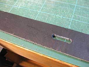 Leather strap with slot for buckle tongue