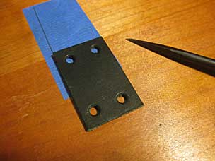 Marking holes for leather strap bit to hold brass loop